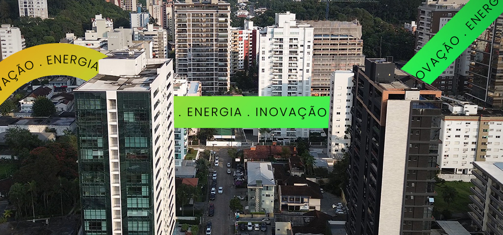 Imagem de uma cidade moderna com prédios altos, destaque para faixas coloridas com palavras-chave como 'energia', 'inovação' e 'energia' representando avanço e tecnologia urbana.